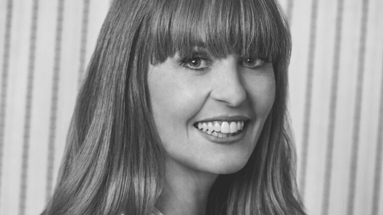 Kirsten Galliott, Board Director at Ten Days on the Island. Professional headshot with the kind of smile that suggests she's already read the board papers.