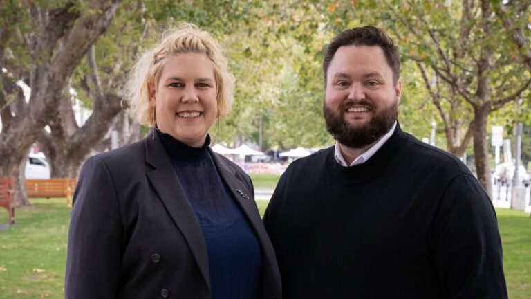 Marnie Karmelita, Artistic Director, and Vernon Guest, CEO of Ten Days on the Island, standing in a park and looking like two people who are about to make a very large festival happen.
